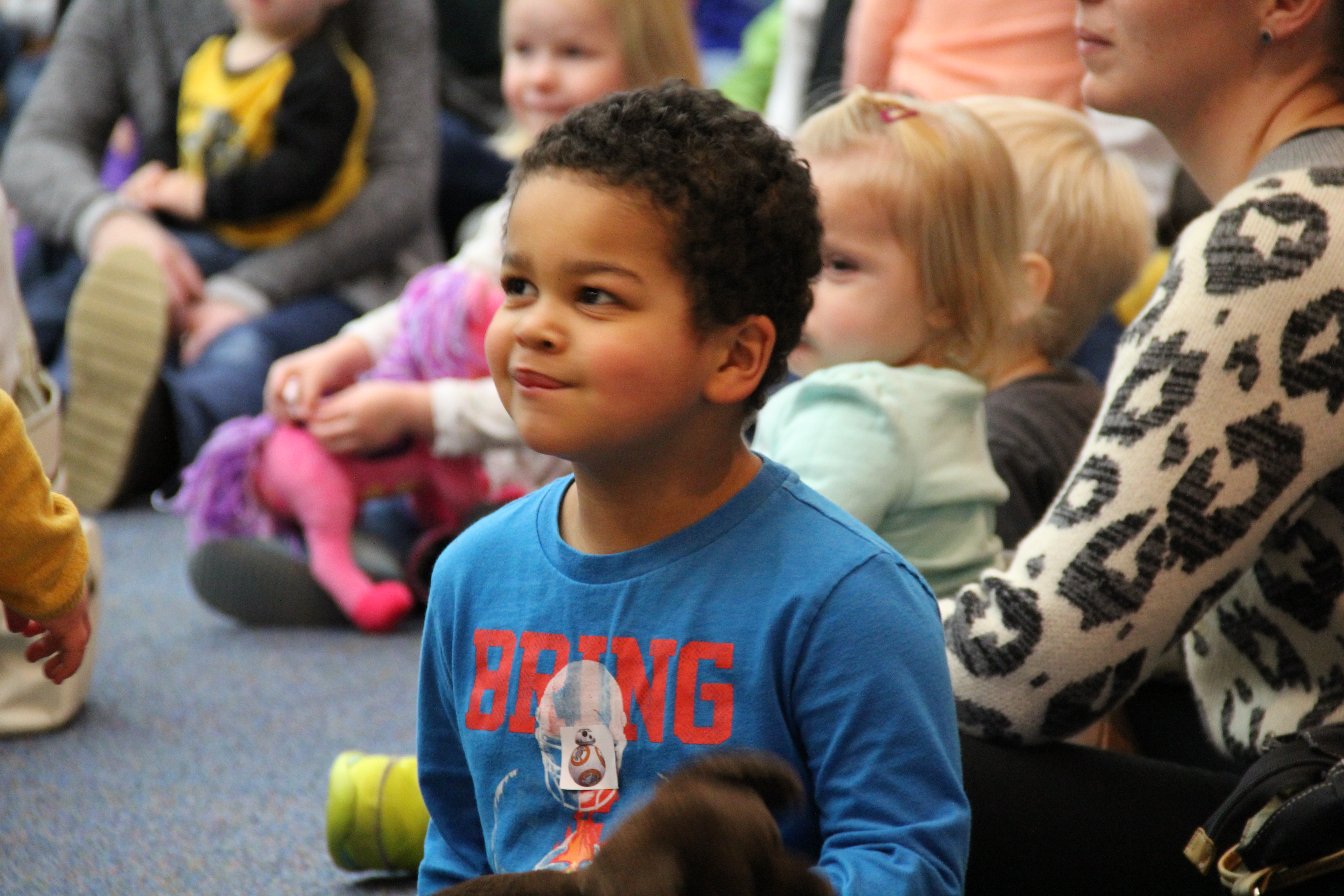 Photo of child engaged in listening to a story.