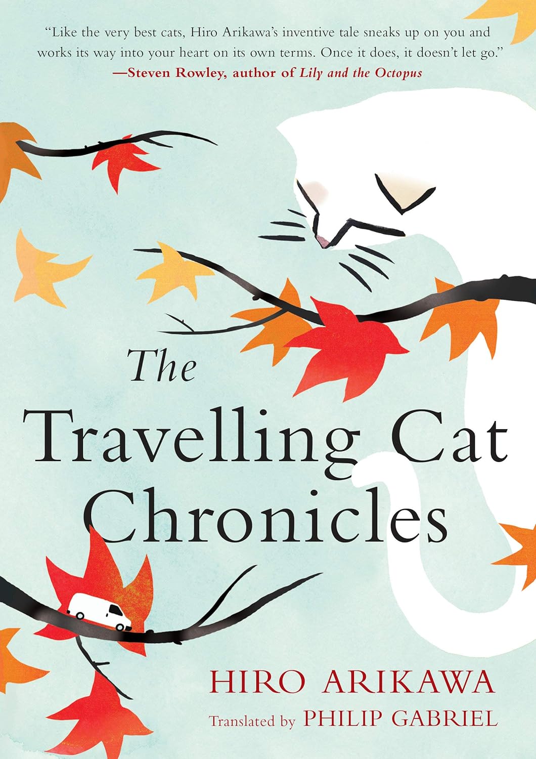 Book cover shows a white cat behind autumn leaves