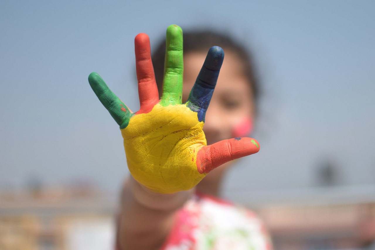 child with painted hand
