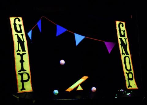 glow in the dark bunting, balance beam, balls & signs with the words "Gnip Gnop"