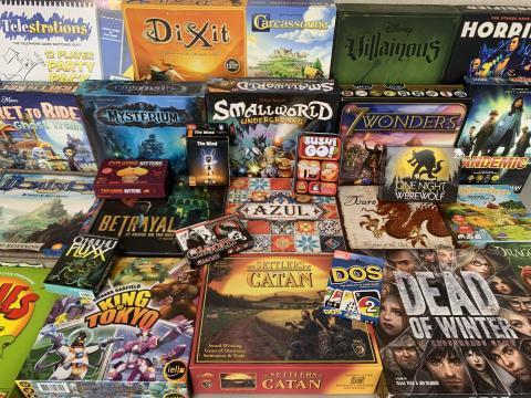 Photo of a bunch of games stacked on a table