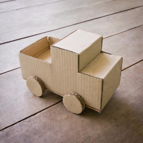 small toy truck made out of cardboard