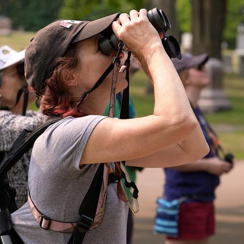 picture of Amy Simso Dean using binoculars