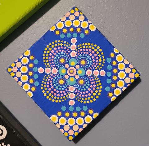 photo of a canvas painted with dots