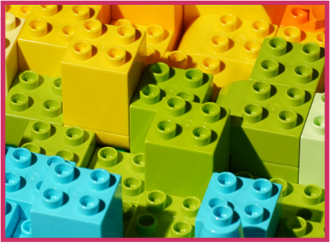Multicolored Legos® stacked on top of one another.