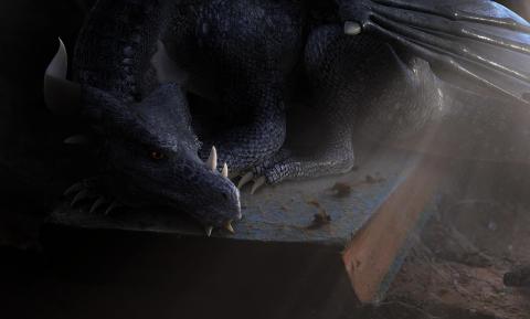 Picture of a small dragon curled up on a book.